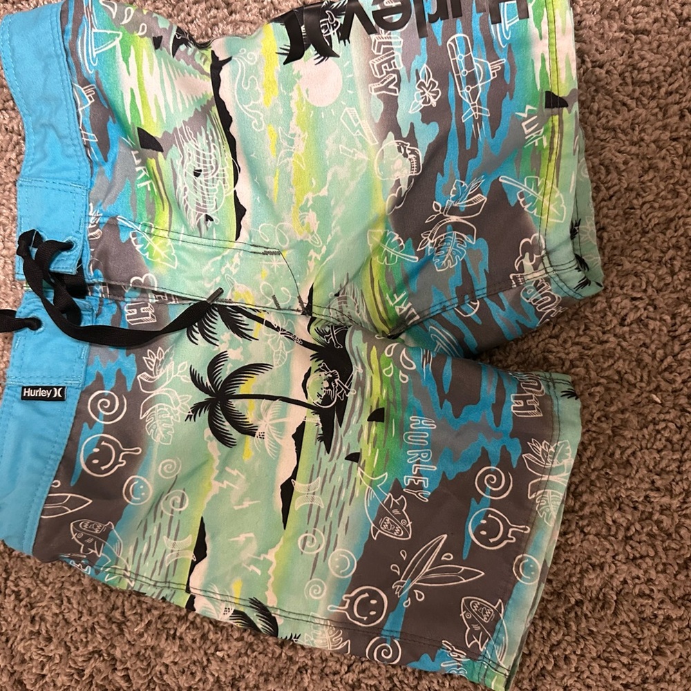 Hurley little boys Tropical Blue and Green Hybrid Shorts and gray bathing suit.